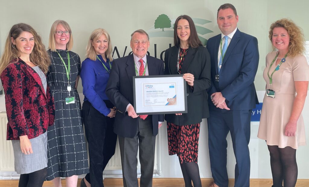 Image of Wealden District Council being awarded with a certificate to recognise that they have achieved Wellbeing at Work Bronze Award.