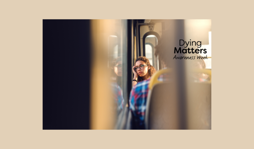Image of a reflective woman on a bus, for Dying Matters Week campaign