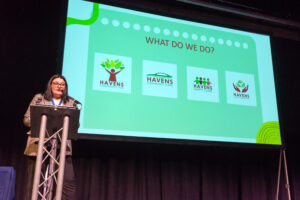 Woman presenting on stage