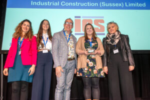 Employees receiving an award on stage