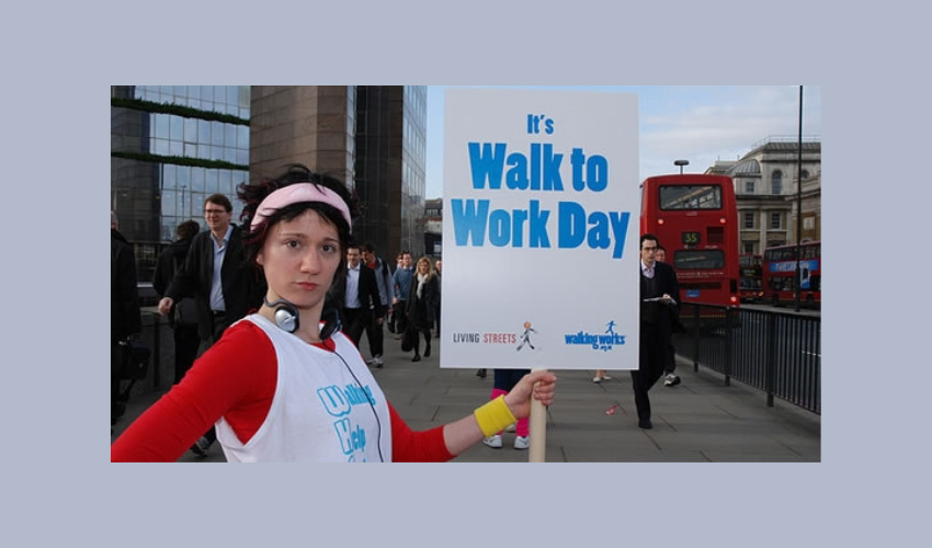 Woman walking to work in London to promote Walk to Work Day