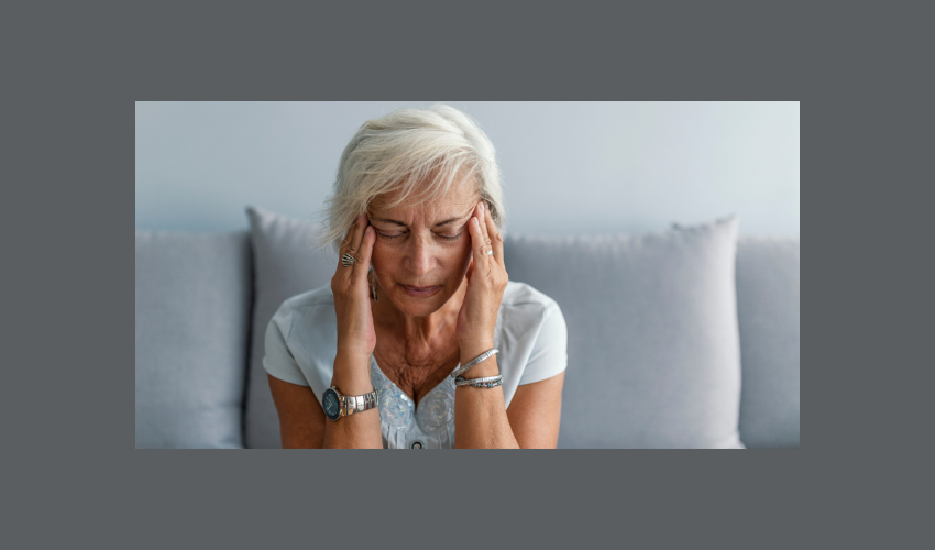Woman holding her head in pain.