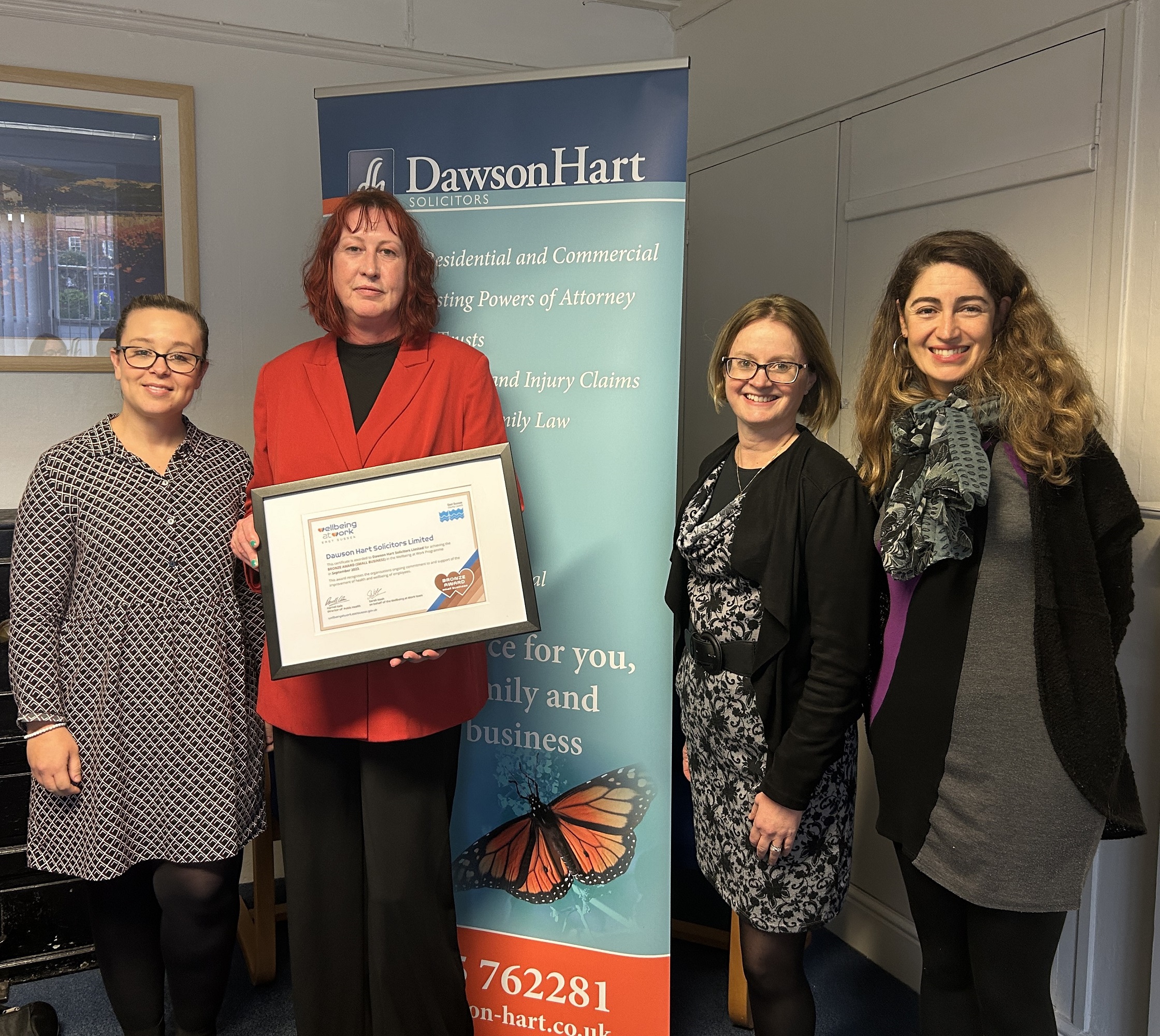 ESCC staff and Dawson Hart Solicitors employees awarded with framed certificate of Bronze Award Wellbeing at Work accreditation